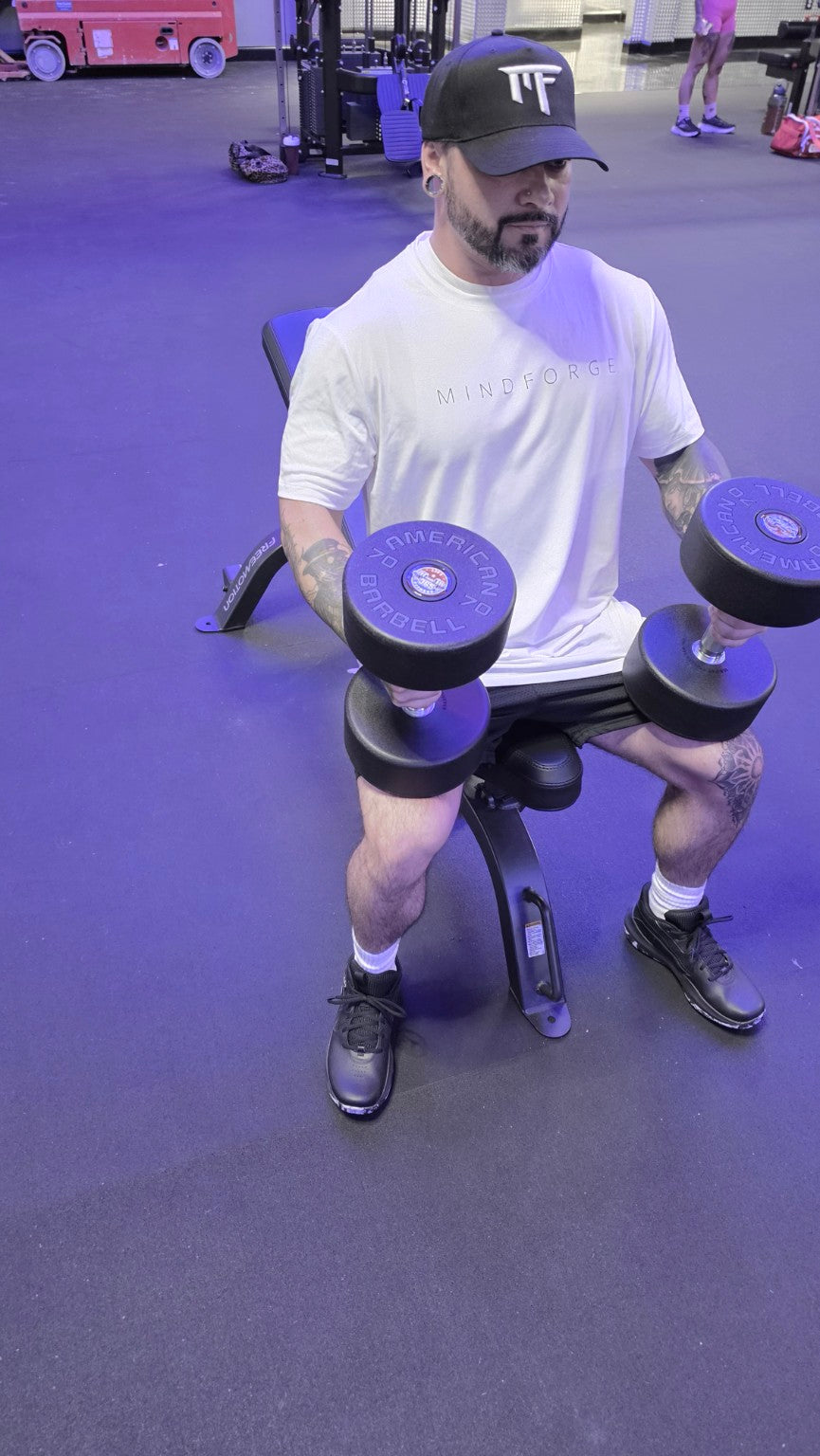 MindForge MF snapback worn during dumbbell training