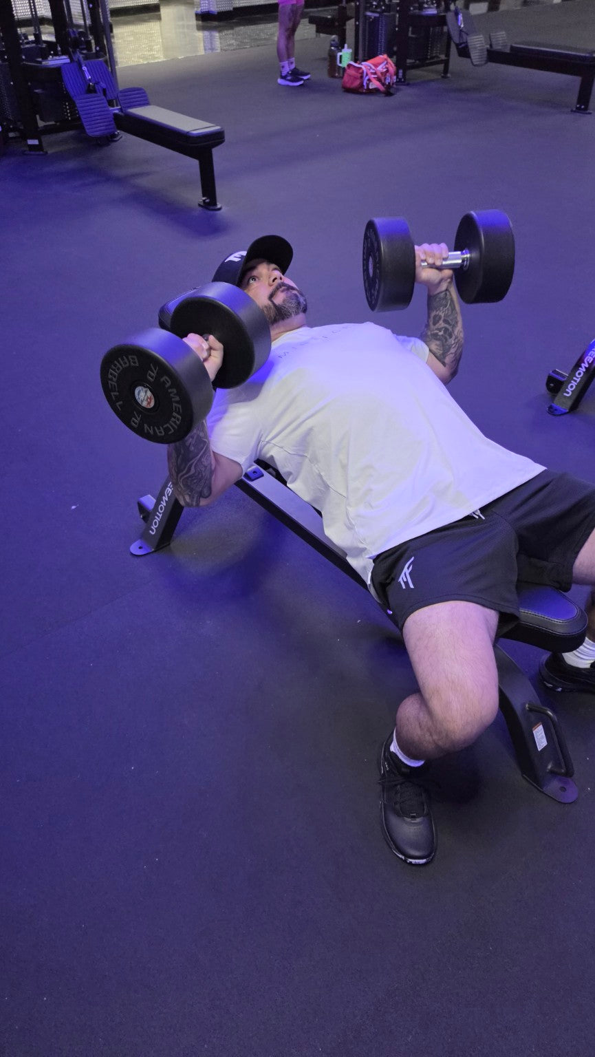 MindForge Essential Tee and MF mesh shorts during dumbbell training